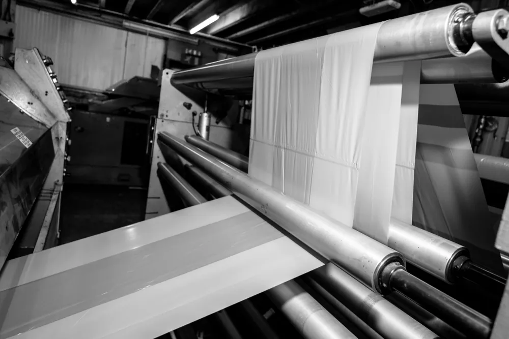 Film running through rollers on a production line